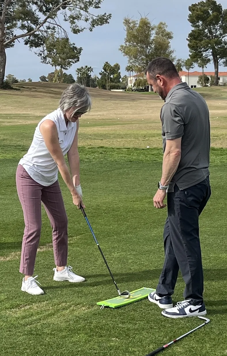 Coach Erik with Student on Range