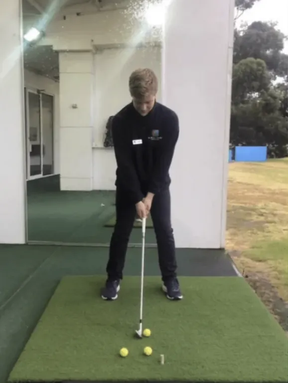 Coach Erik with Student on Range