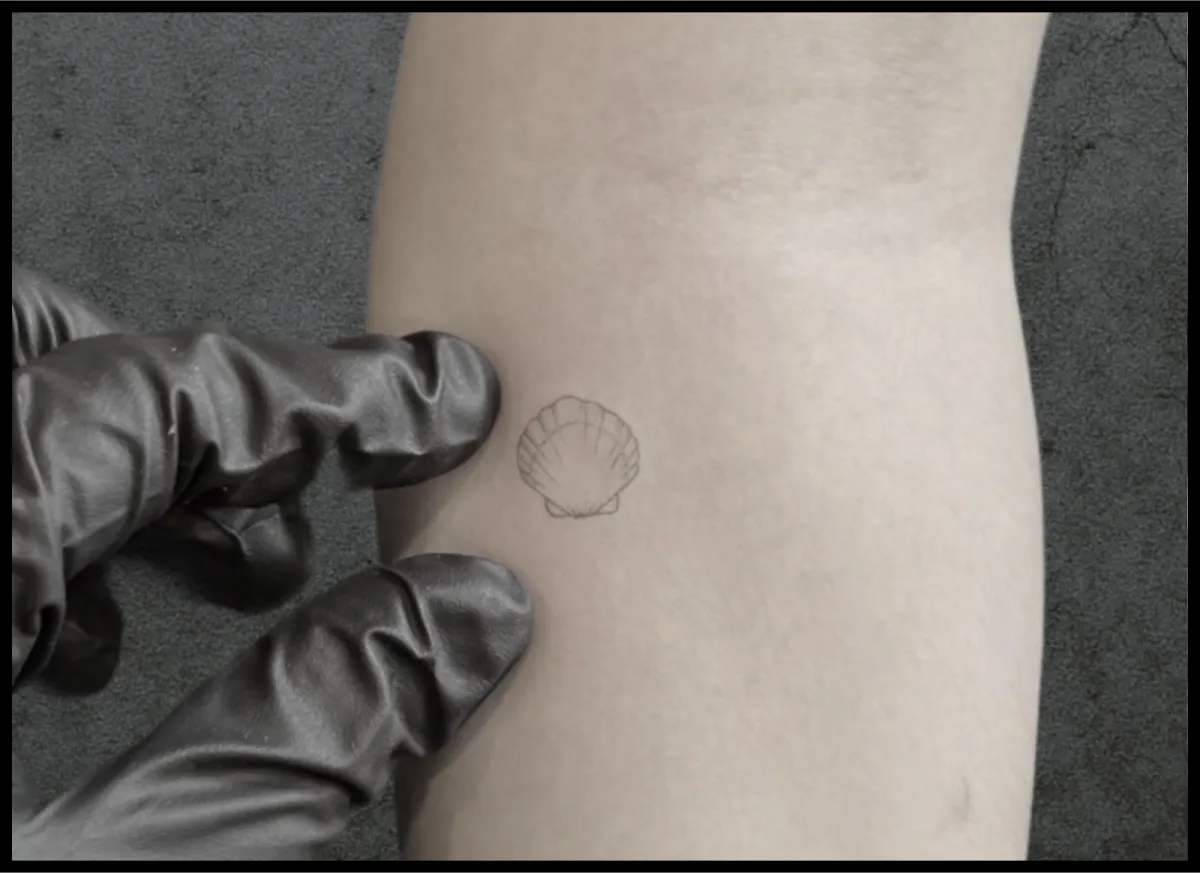 Micro realism seashell tattoo