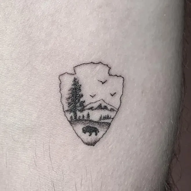 Horse with flowers tattoo on arm