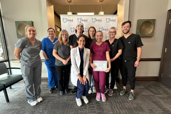 Dental assistant performing coronal polishing on a patient at a certified training course in Illinois