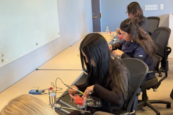 Dental assistant performing coronal polishing procedure during hands-on certification training in Chicago, Illinois