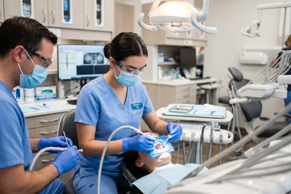 Dental assistant placing a composite restoration during EFDA Restorative training in Illinois