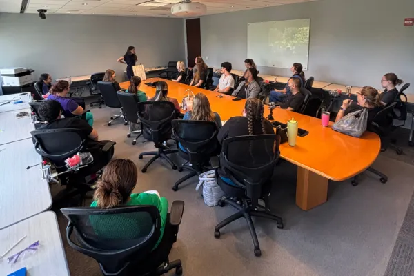 Dental assistant taking a certification class in a training classroom