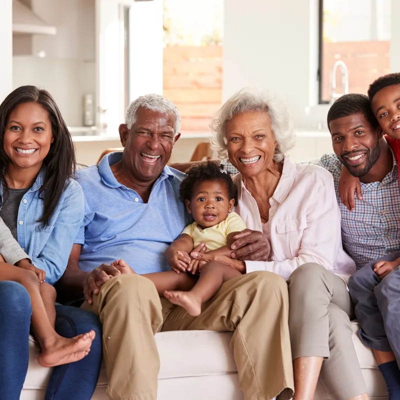 Two men looking at a script by a camera.