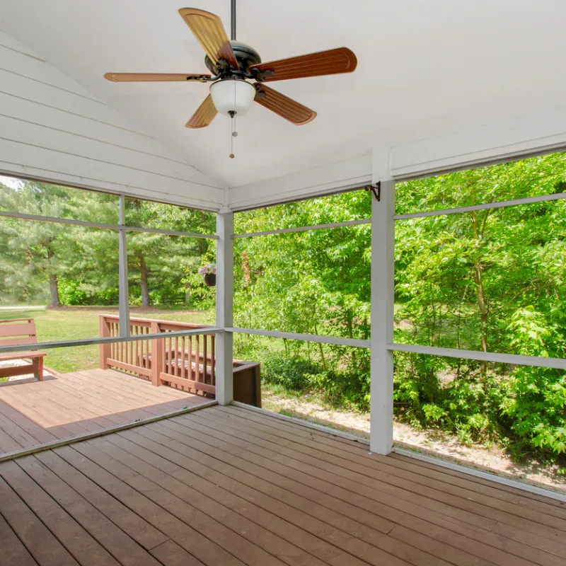 Custom screened-in patio with seating and open outdoor living space