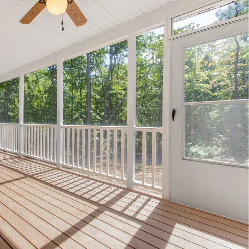 Porch screening contractor installing a screened patio enclosure at a home