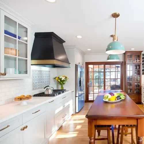 Modern kitchen remodeling with white cabinetry, stainless steel appliances, and updated finishes.