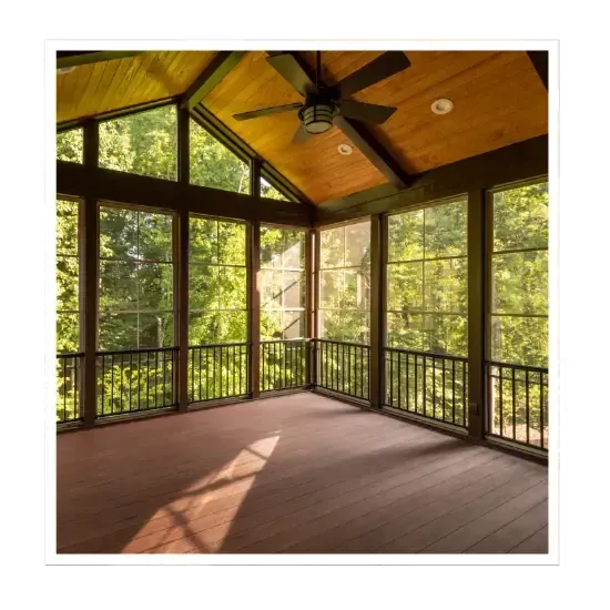 Screened porch construction with wood ceiling and large windows overlooking trees.