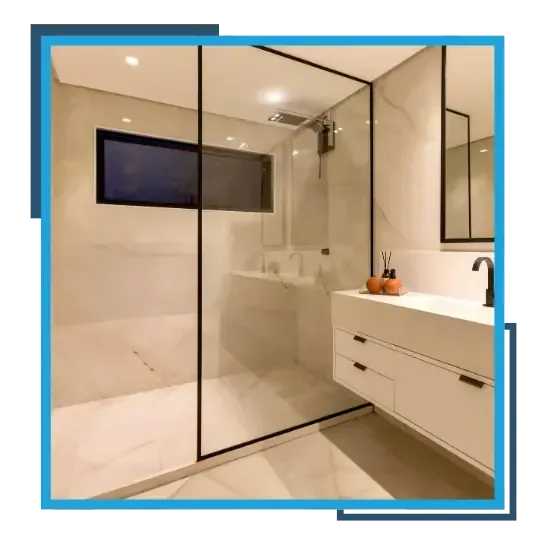 Modern bathroom renovation with glass shower enclosure and updated vanity.