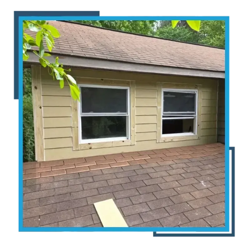 Exterior home renovation with new siding, windows, and brickwork.