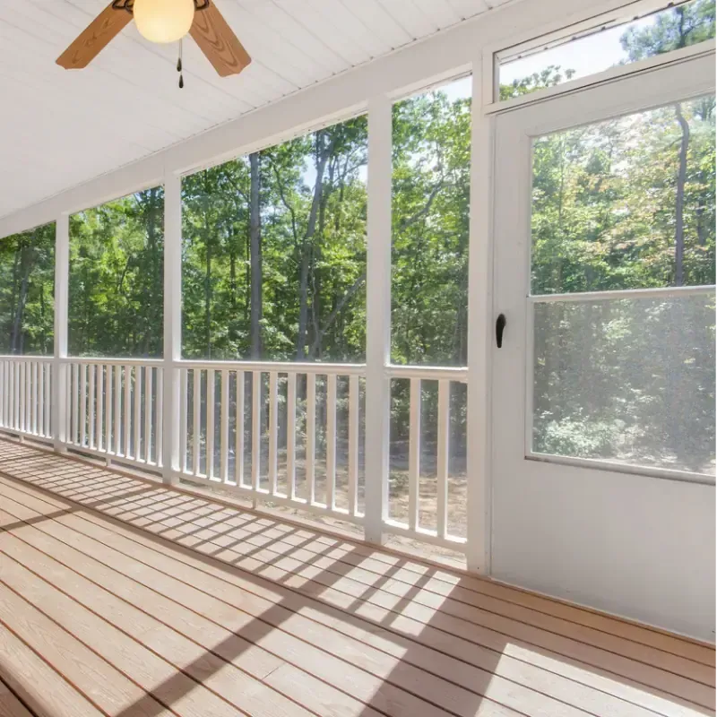 Porch screening contractor installing a screened patio enclosure at a home