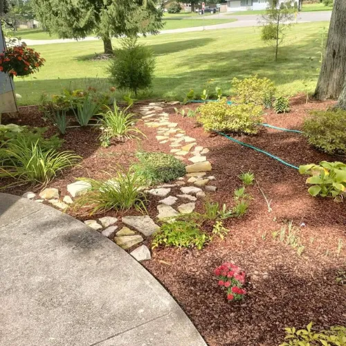 Beautiful stepping stone pathway in a custom garden designed and installed by Tyler Anthony Group