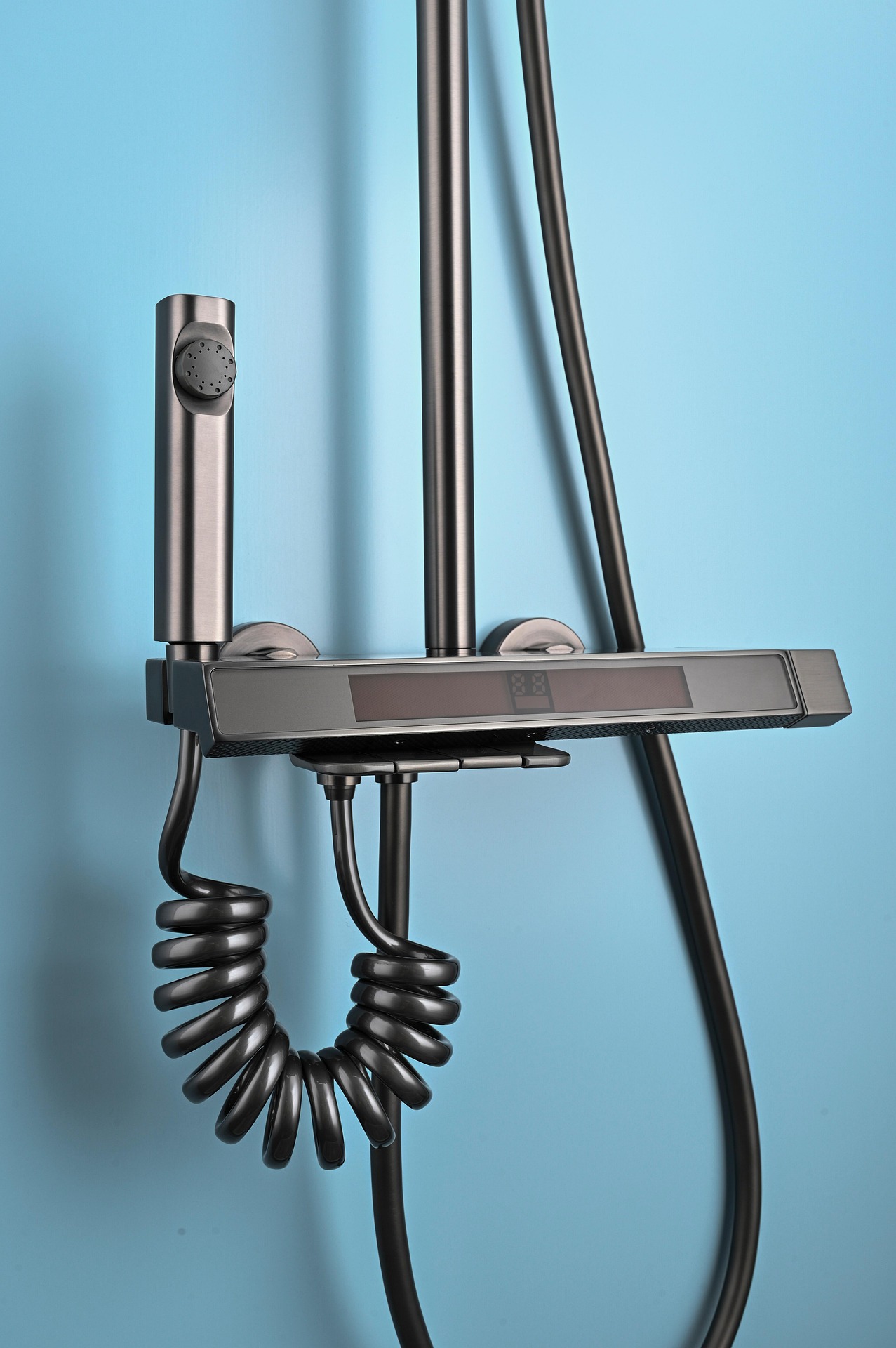 black shower with blue wall in background