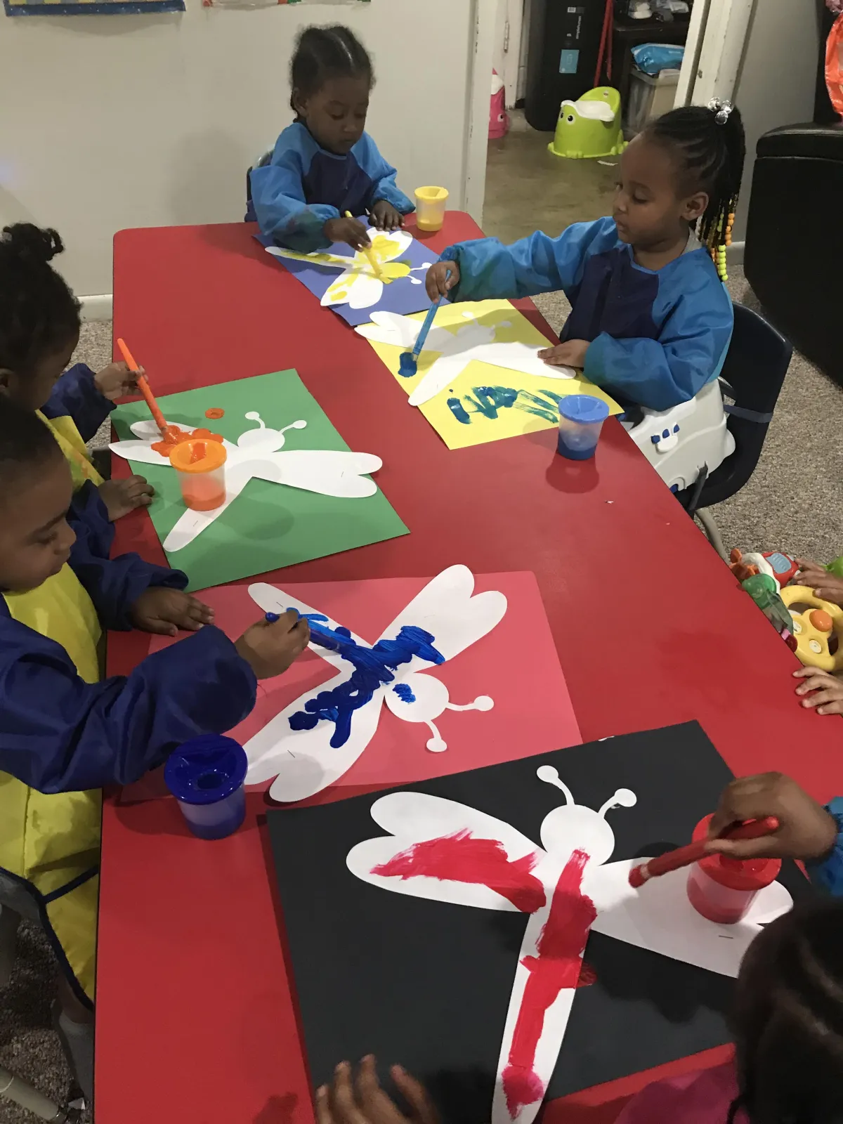 Girl follows directions during arts and crafts time.