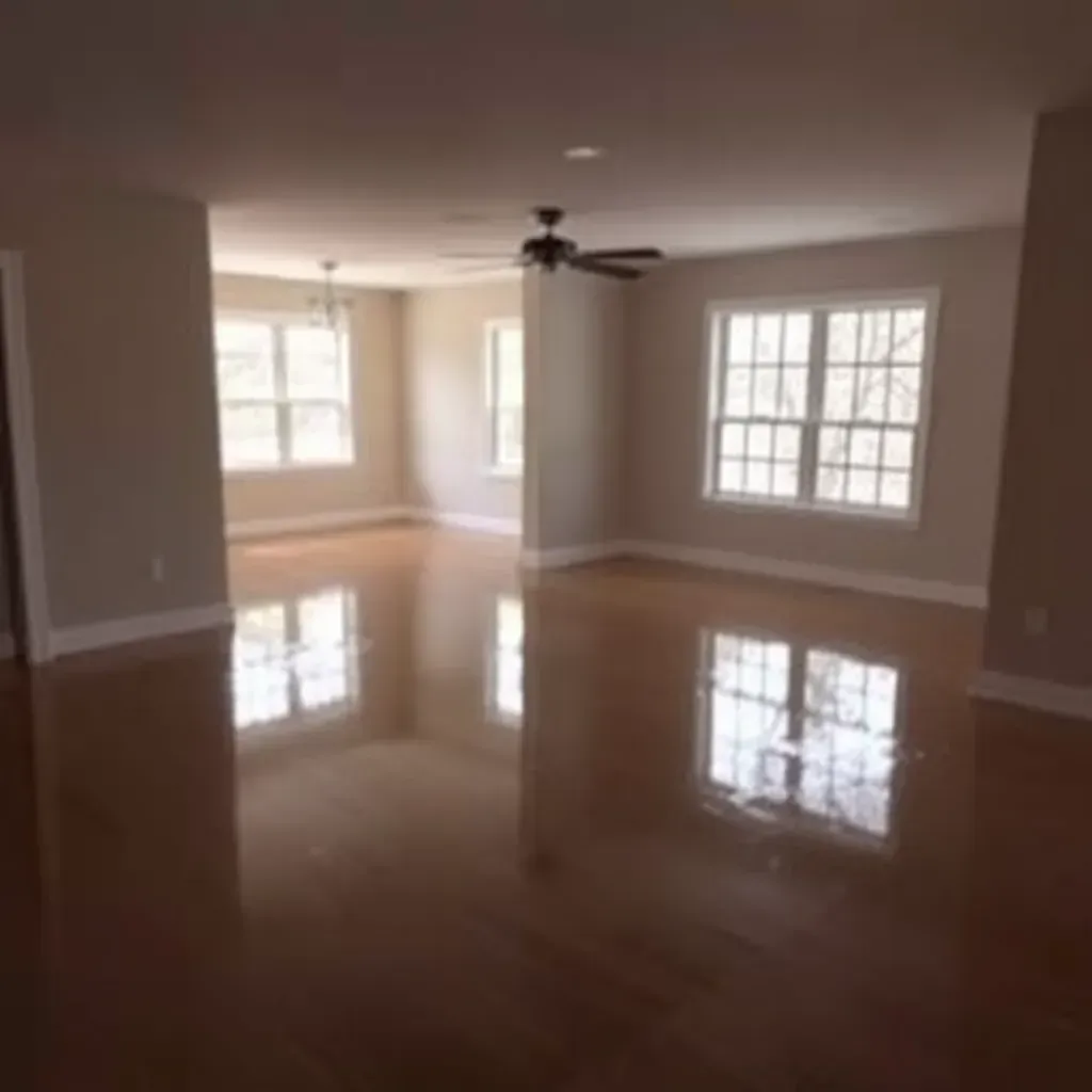 Water damage restoration in Wake Forest NC showing wet carpet, drying equipment, damaged drywall, and sunlight in a residential home.