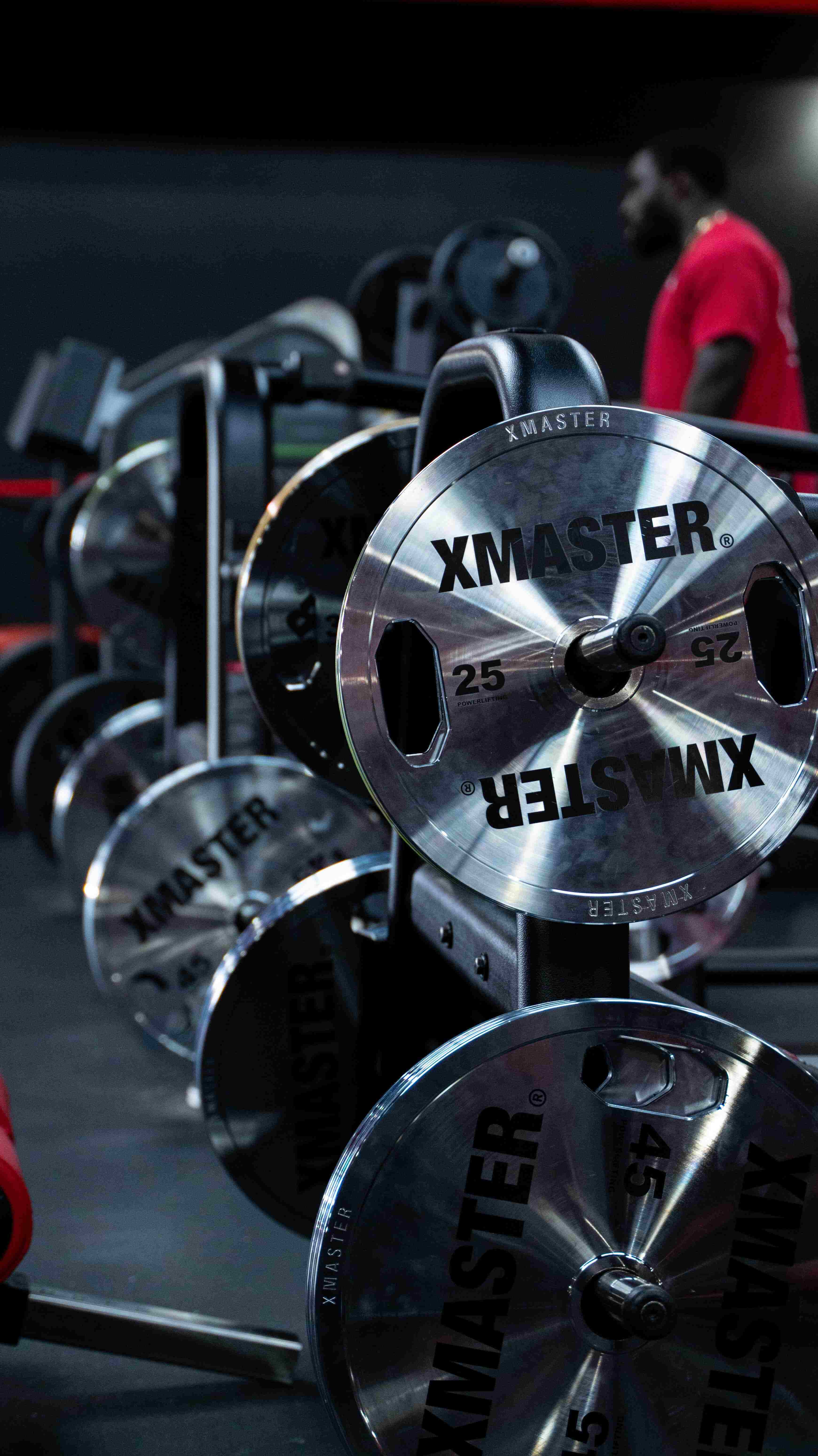 Heavy duty industrial powerlifting equipment in a stark gym setting