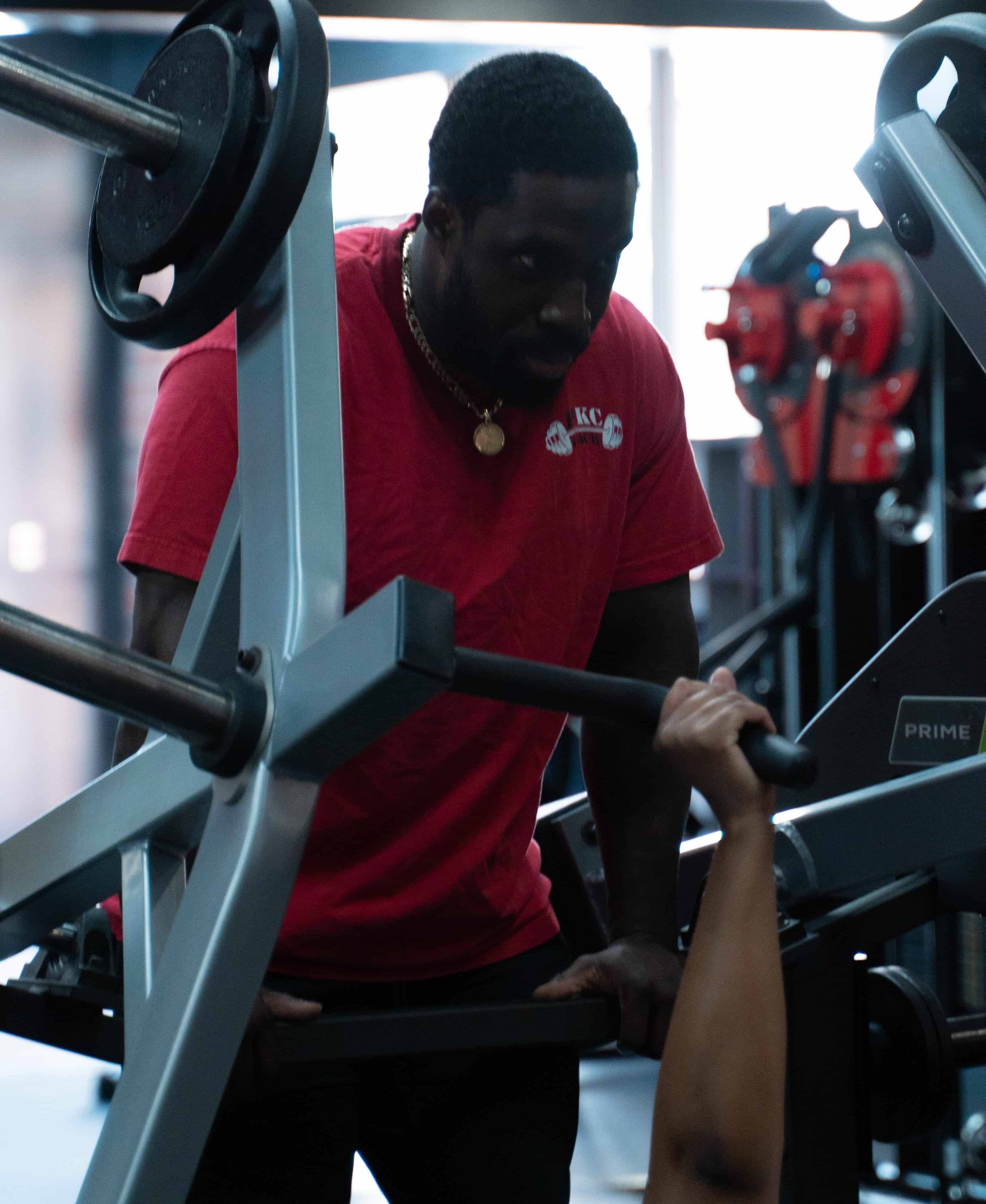 Heavy duty industrial powerlifting equipment in a stark gym setting