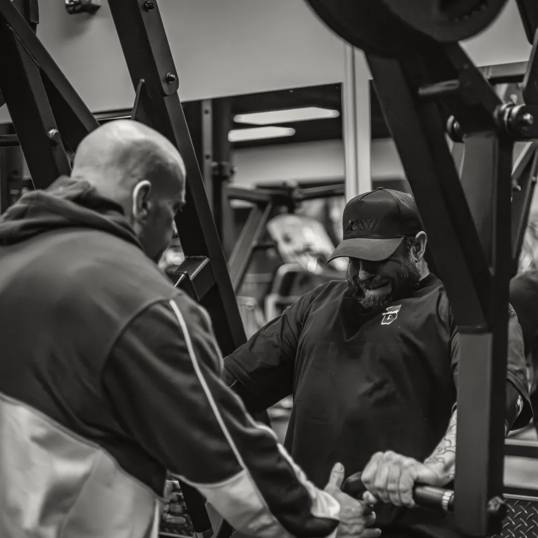 person facing down and holding two rods