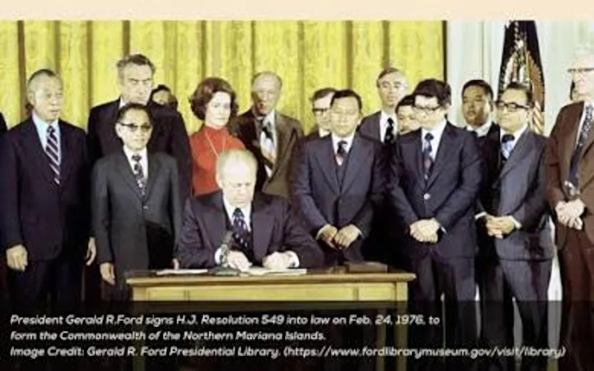 President Gerald R. Ford signing the Covenant to Establish a Commonwealth in Political Union with the United States of America into law.