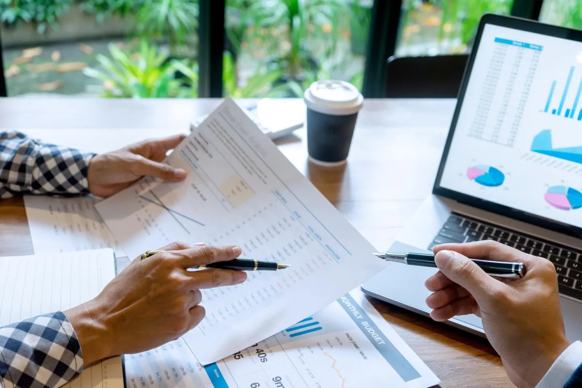 woman talking through mobile phone while sitting on swivel armchair