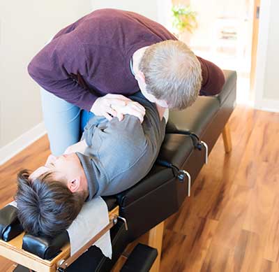 Manual chiropractic adjustment for back pain relief in Saint Peter MN.