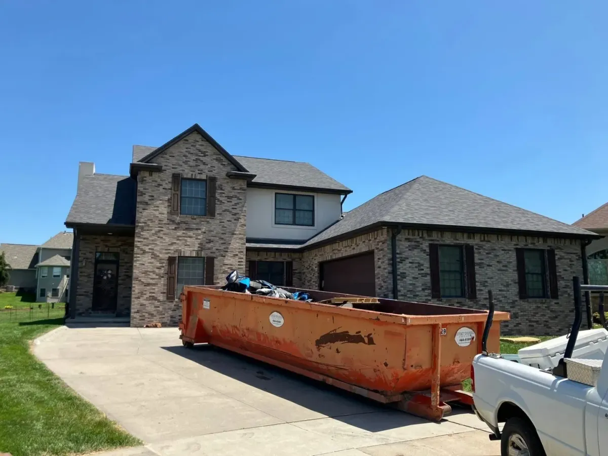 Roof installation Auburn NE — crew setting shingles and drip edge — Knapp Roofing LLC