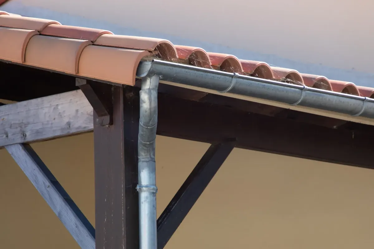 Guttering services Avoca NE — crew installing seamless gutters on home — Knapp Roofing LLC