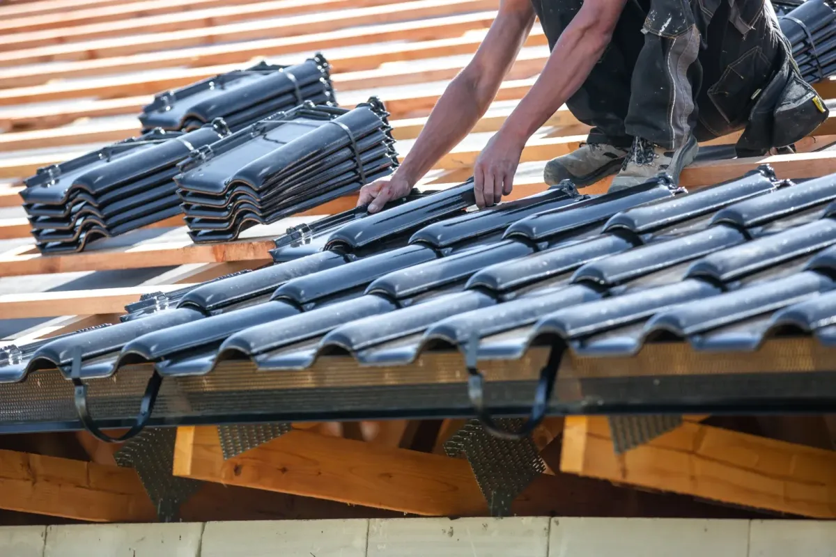 Roof Replacement Nebraska City NE — crew installing shingles on home — Knapp Roofing LLC