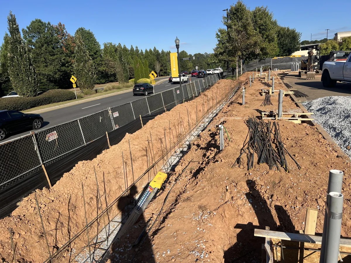 Modern skyscraper against a cloudy blue sky