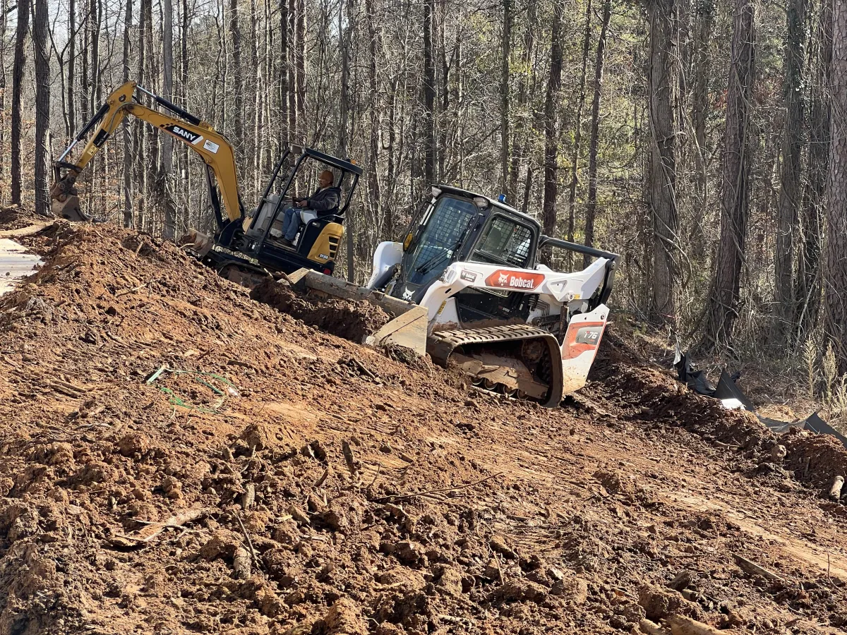 Welder working in a dark industrial setting
