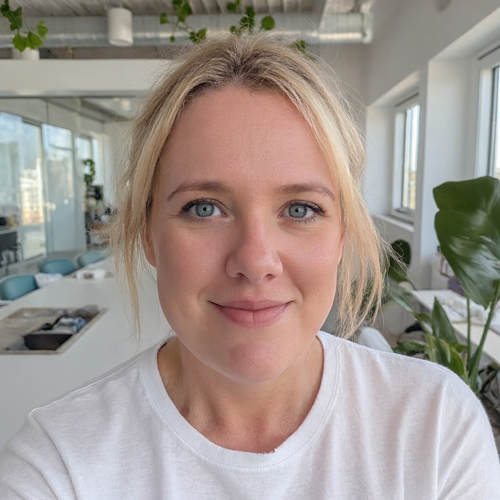 Portrait of female behavioural sleep specialist smiling in a bright home setting