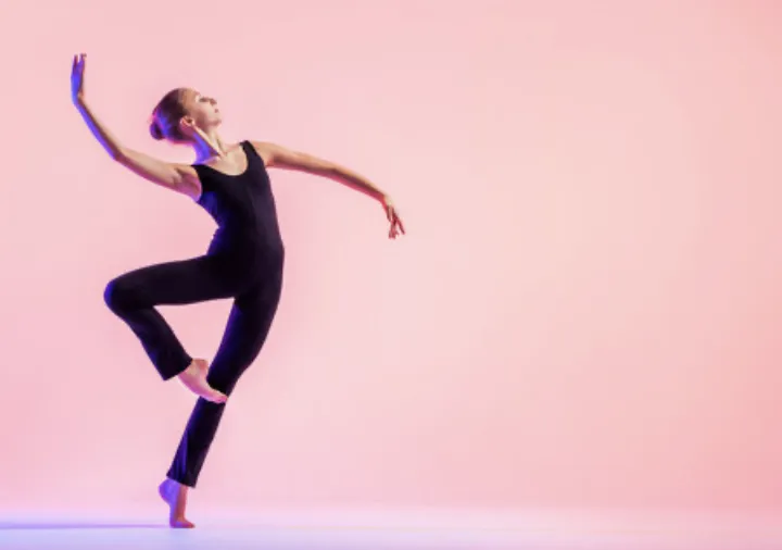 Dancer practicing jump training exercises in a studio