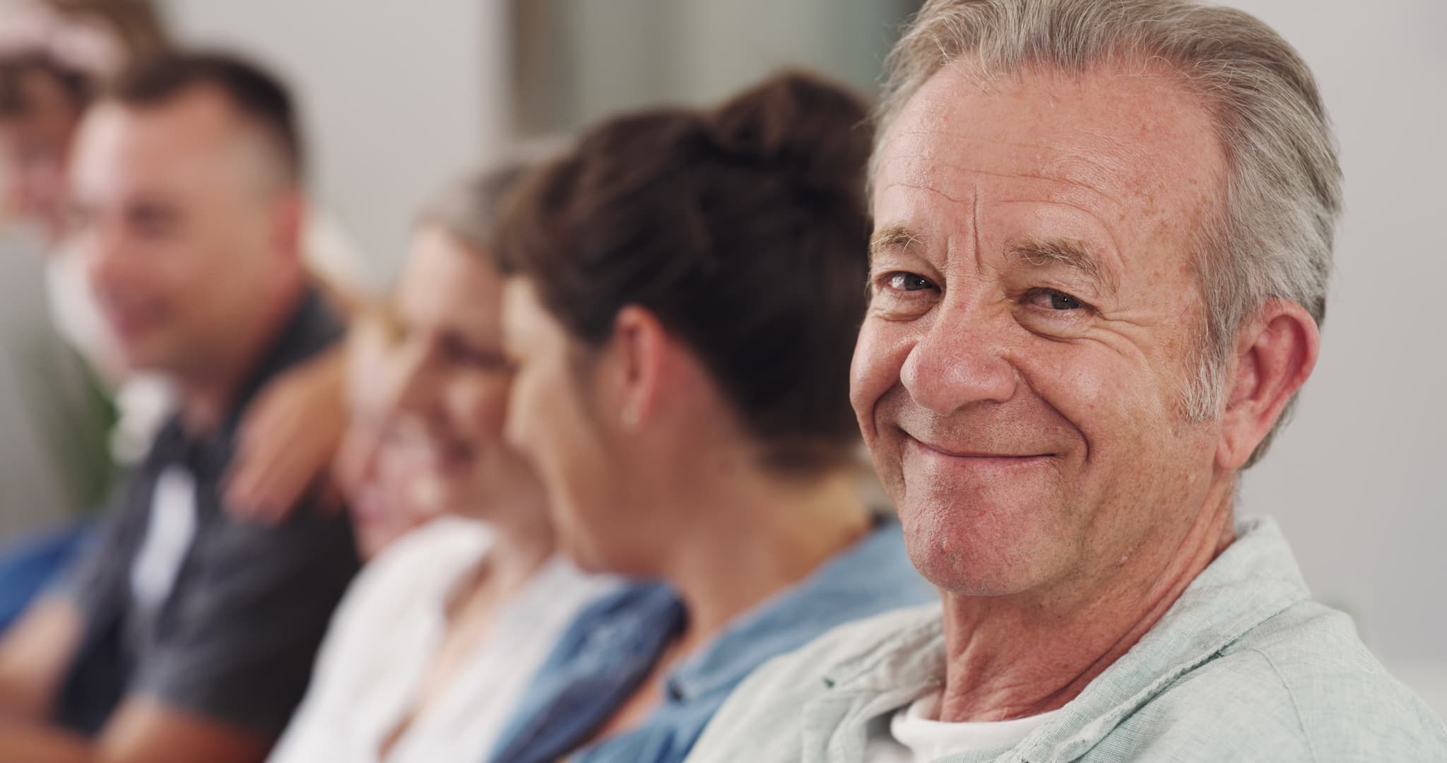 Older gentleman happily enjoying a community-based group