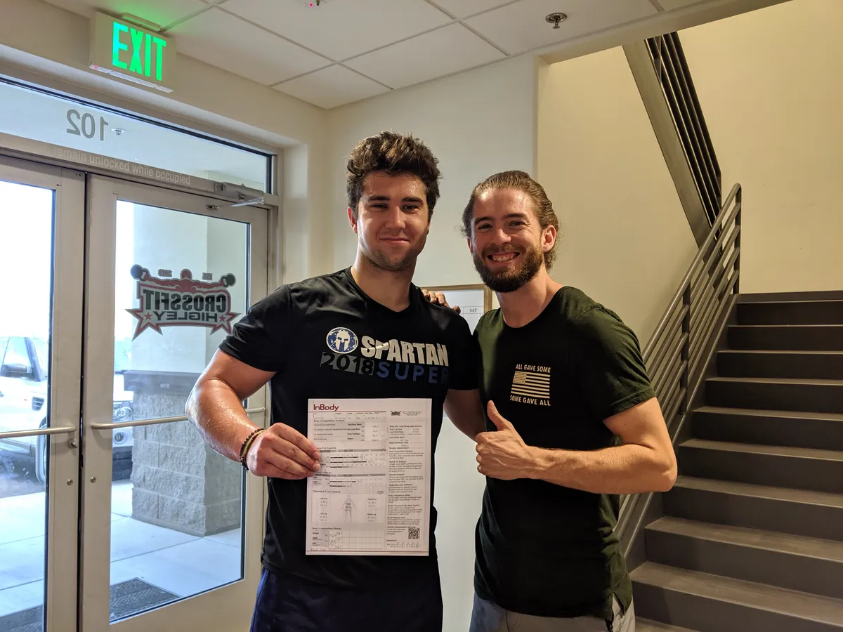 Tyler and a CrossFit HiFi member with InBody body composition scan results at the Queen Creek gym