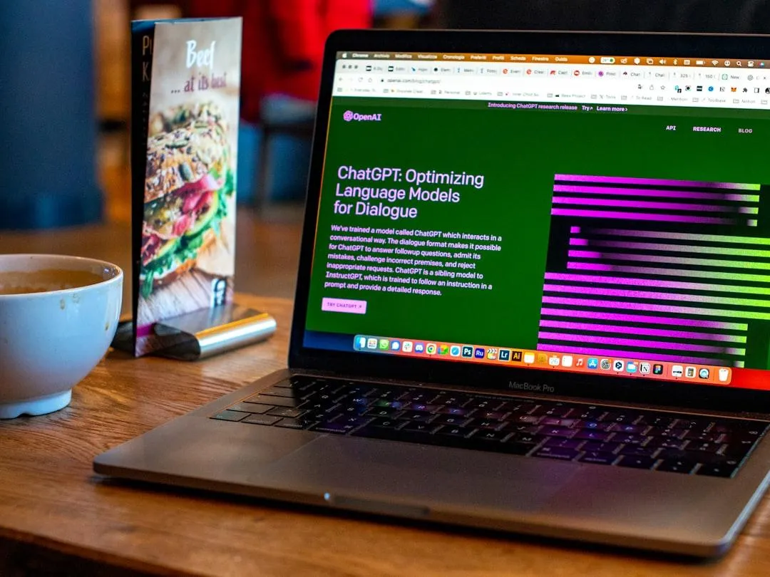 Laptop displaying an AI platform next to a coffee cup, representing tailored solutions for local service businesses.