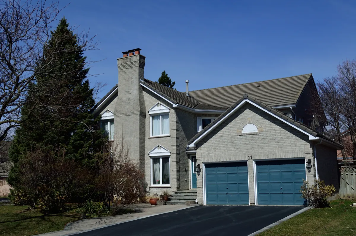 Illustrative photograph of a detached Markham house with a double garage, taken in March 2016.
