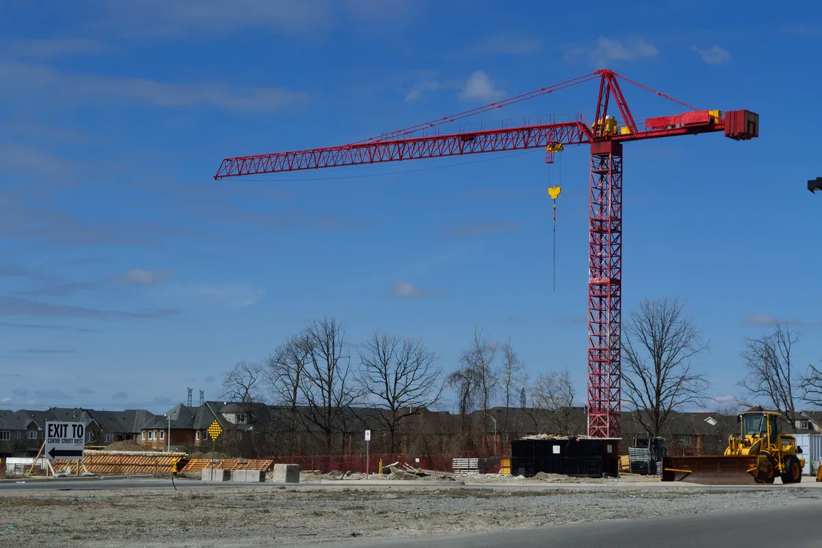 Illustrative red tower crane at a Vaughan construction site, photographed in March 2012.