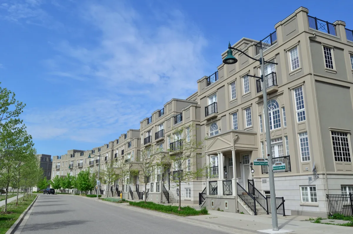 Illustrative photograph of a row of townhouses in Downtown Markham, taken in 2020.
