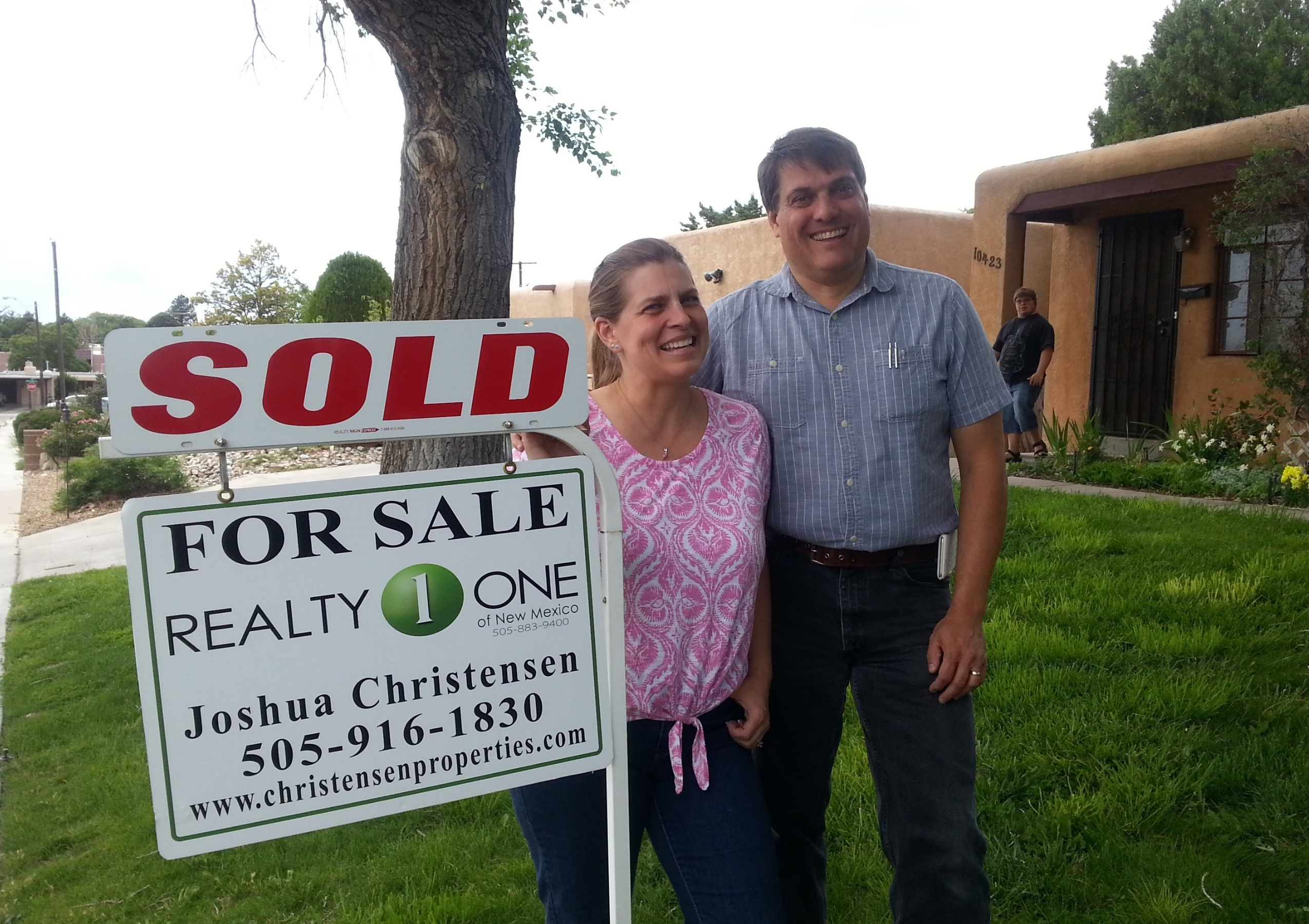 Albuquerque homeowners celebrating a successful home sale with Christensen Properties