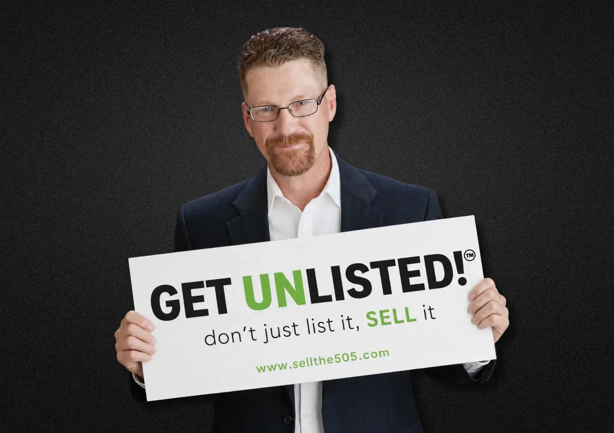 Joshua Christensen holding a GET UNLISTED™ sign board