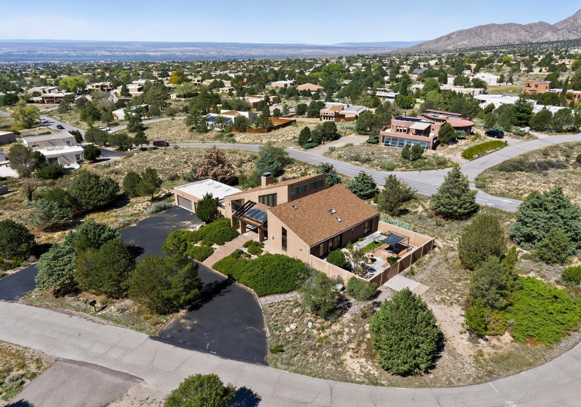Aerial view of 450 Live Oak Lane and the surrounding Sandia Heights neighborhood in Albuquerque, New Mexico