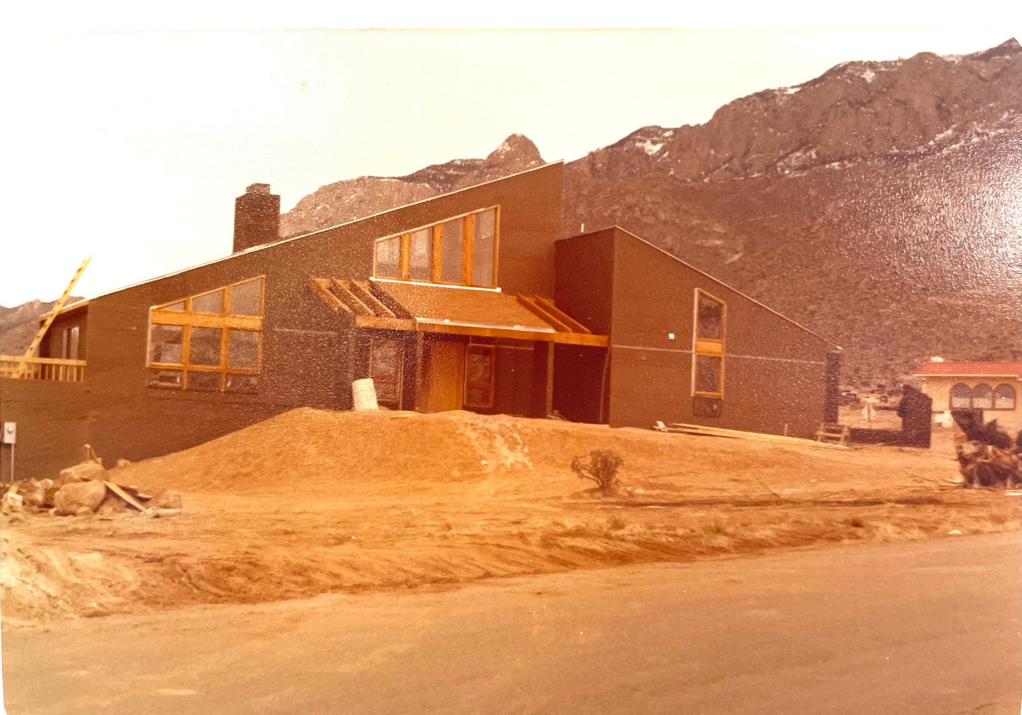 Historic exterior photo of 450 Live Oak Lane showing the original Ron Hutchinson architectural design in Sandia Heights