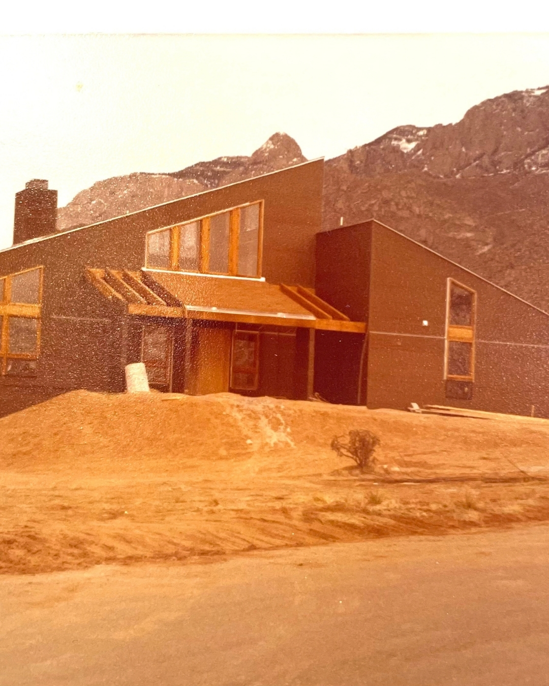 Historic exterior photo of 450 Live Oak Lane showing the original Ron Hutchinson architectural design in Sandia Heights