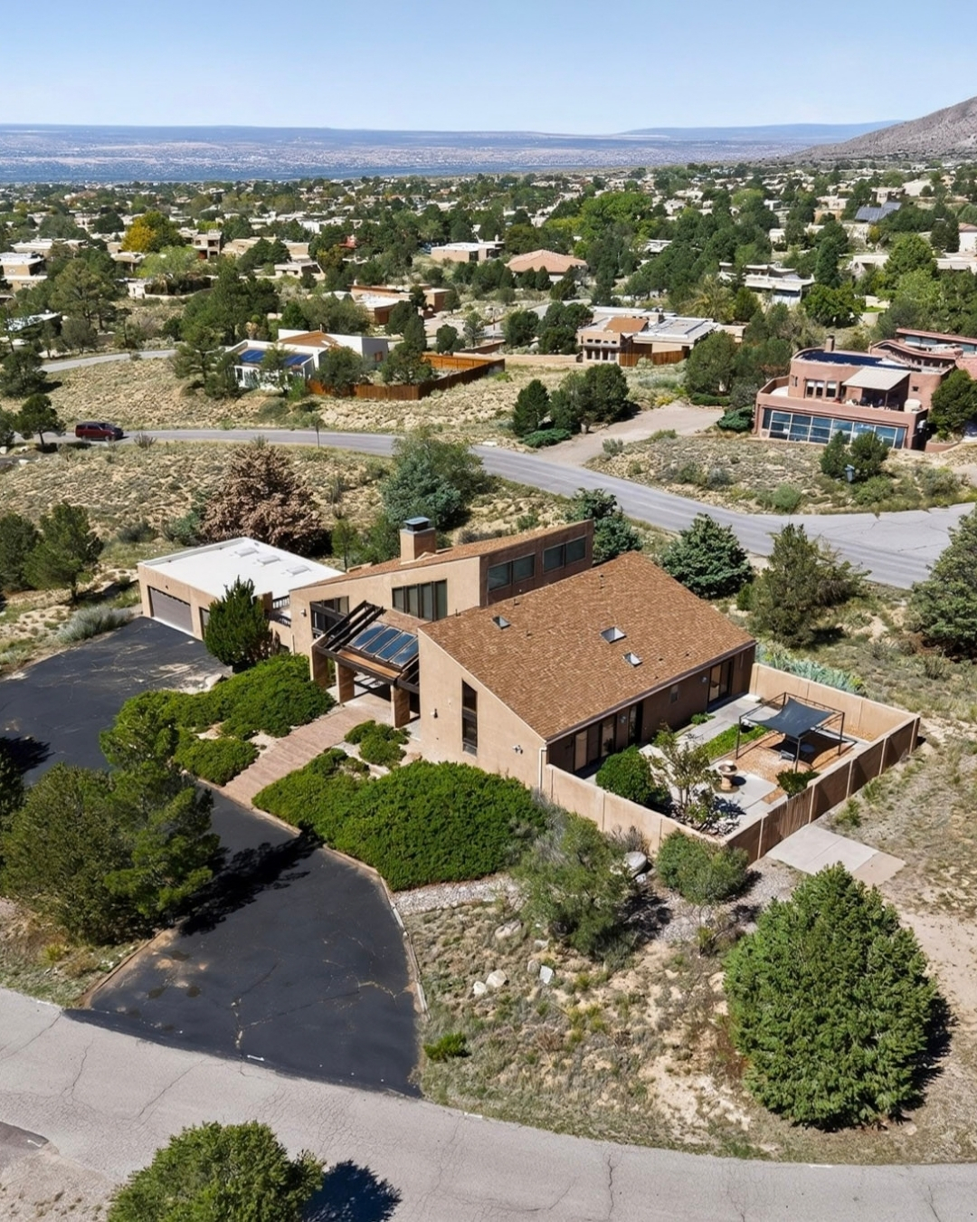 Aerial view of 450 Live Oak Lane and the surrounding Sandia Heights neighborhood in Albuquerque, New Mexico