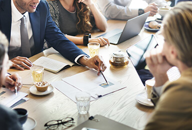 Property developer on-site reviewing blueprints for property finance