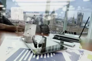 Property developer on-site reviewing blueprints for property finance