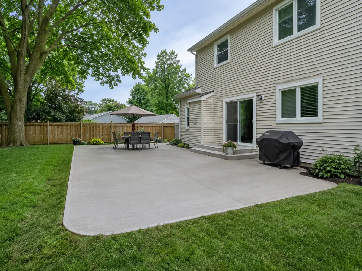 Finished backyard concrete patio in Racine, Wisconsin by GM Concrete