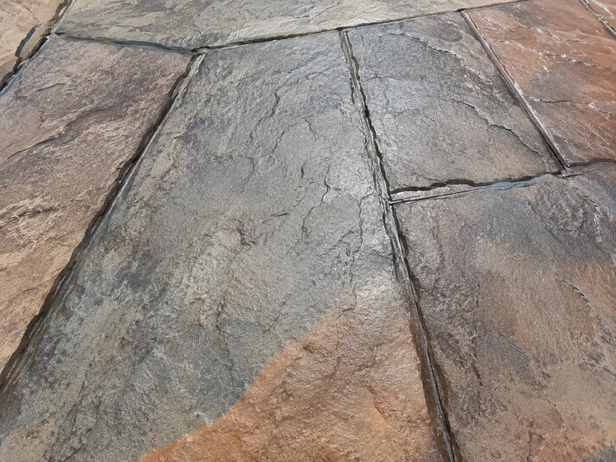 Stamped concrete with earth-tone slate pattern by GM Concrete in Racine, WI