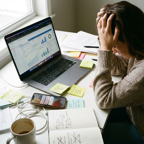 frustrated woman juggling multiple systems